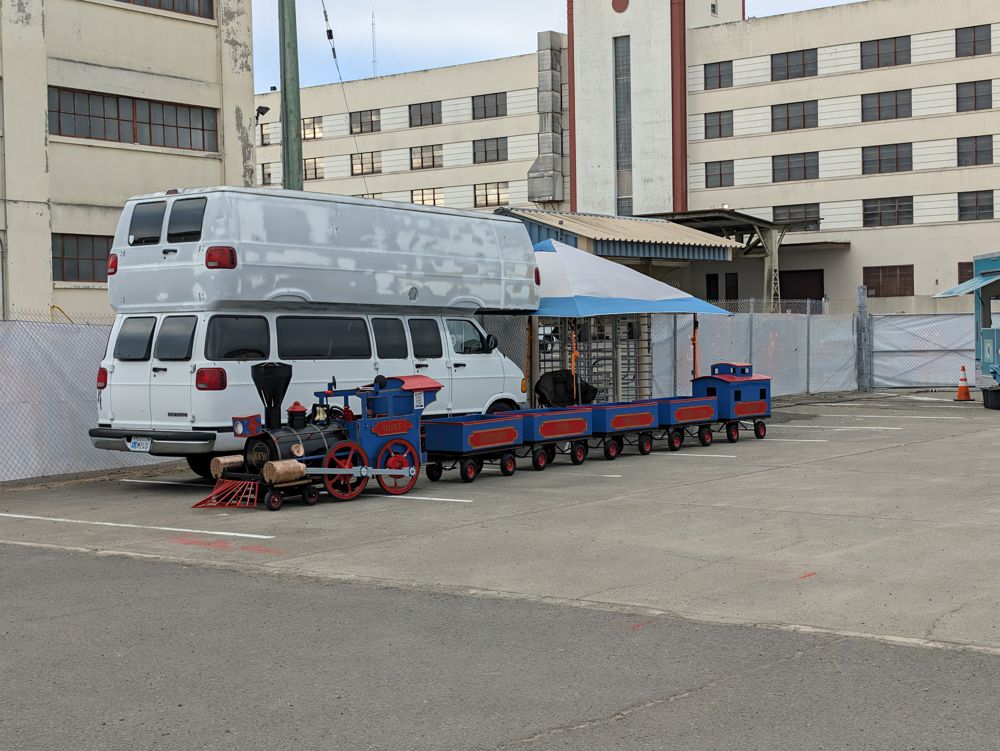 A miniature train parked in front of the old Navy buildings on Mare Island
